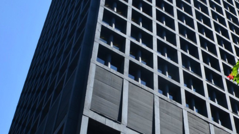 Worms eye view of tall office building