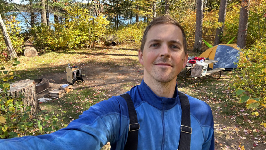 Adam Stroud camping with tent and gear