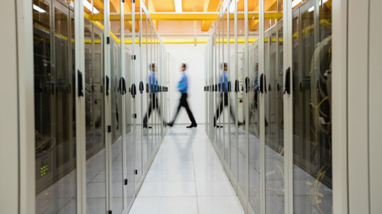 Technician walking in server room