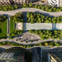 Aerial view of Salesforce Park in San Francisco, California, USA. People are walking and relaxing in the park, enjoying the green space and urban oasis.