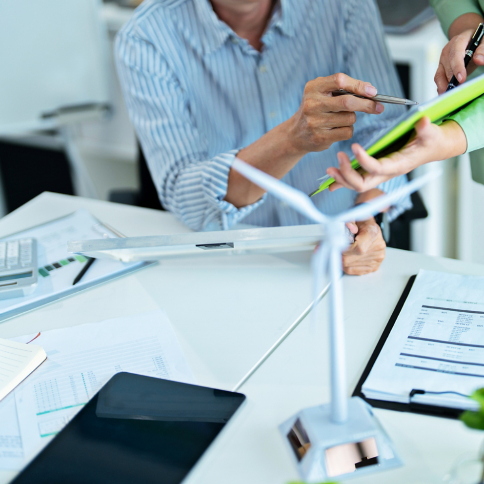 Corporate team researching sustainable alternatives for carbon reduction and clean energy growth