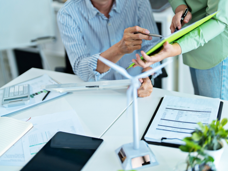Corporate team researching sustainable alternatives for carbon reduction and clean energy growth