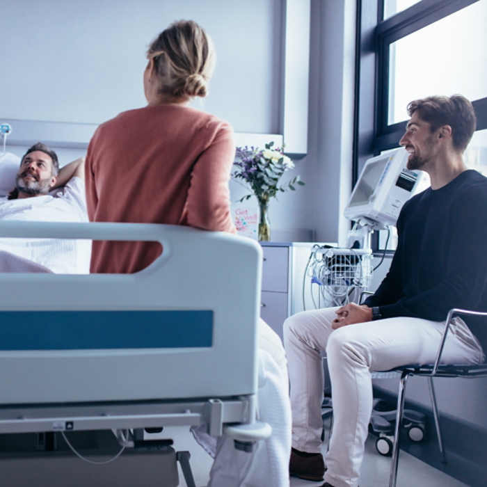 Family and friends visiting patient and talking with doctor