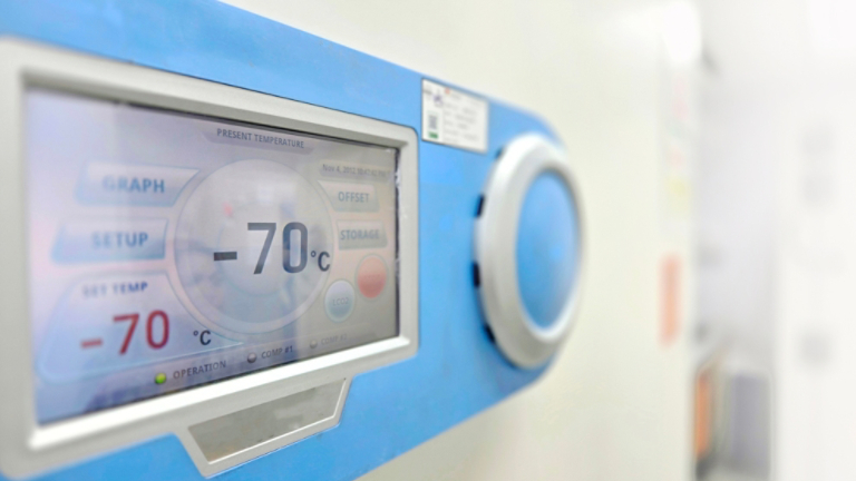 Selective focus of ultra low temperature -76 degree celsius freezer for keeping specimens for laboratory testing in hospital.Front of refrigerator storage blood from patient for research in university