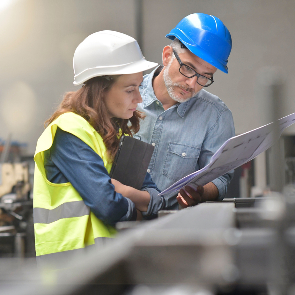 Metal industry manager and engineer meeting in factory