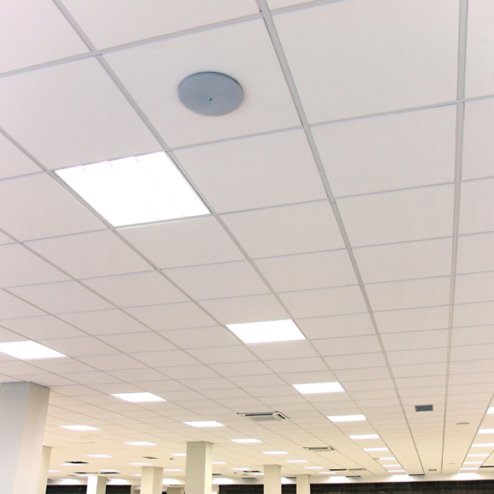 White office ceiling with white tiles and lighting