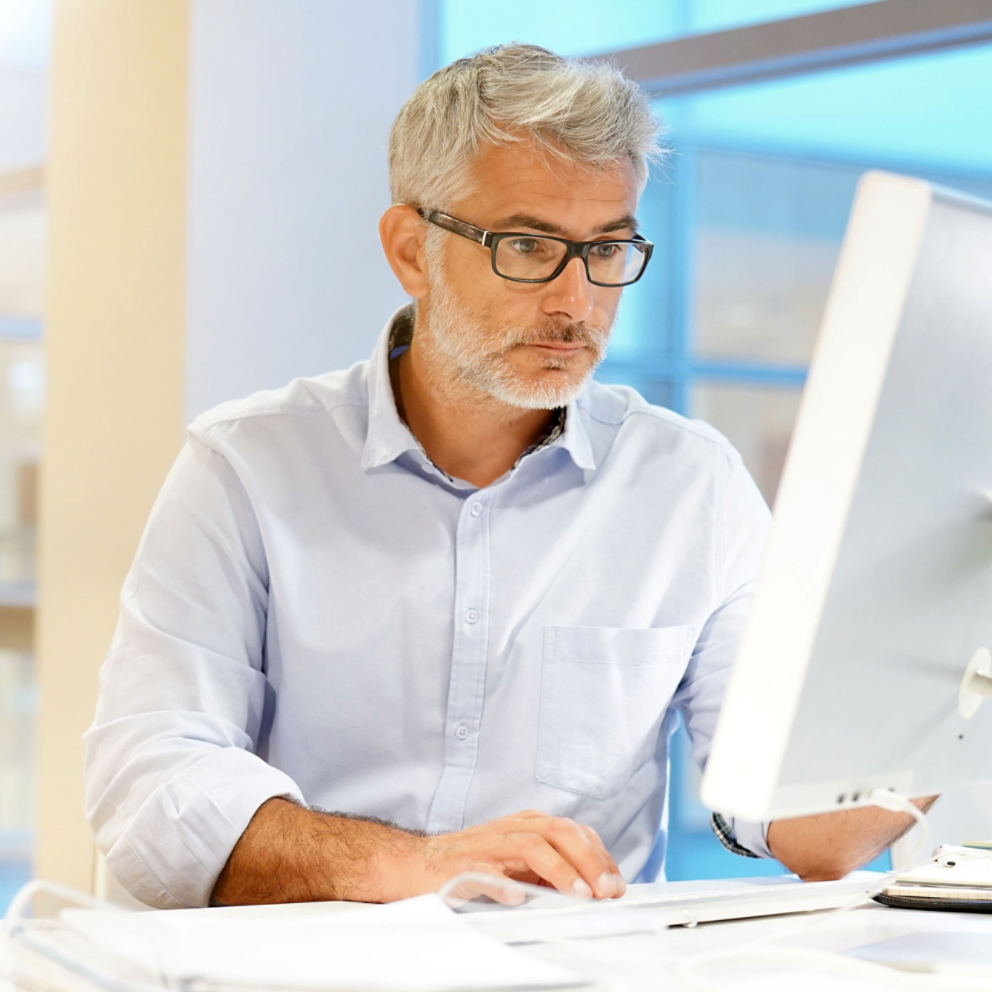 Smart casual businessman working in contemporary office