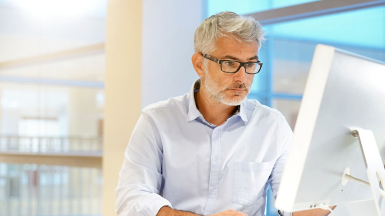 Smart casual businessman working in contemporary office