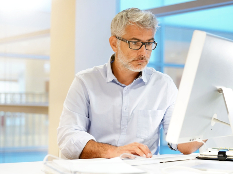 Smart casual businessman working in contemporary office