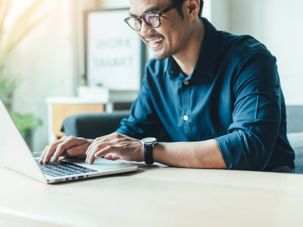 hand holding using texting cell phone and typing computer.businessman at workplace Thinking investment plan.chatting contact Investor.searching for information use internet.connecting people concept