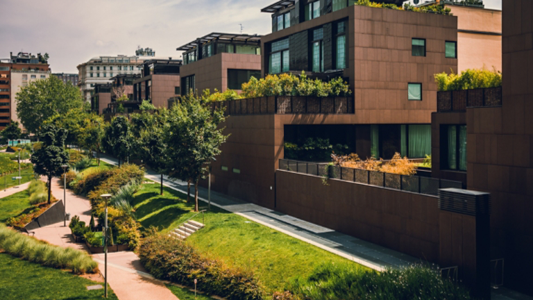 Modern residential buildings in the public green area. Real estate houses in Milan, Italy.