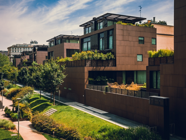 Modern residential buildings in the public green area. Real estate houses in Milan, Italy.