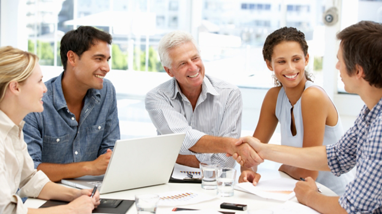 Group of people shaking hands
