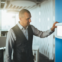 Businessman using electronic panel