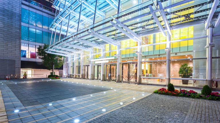 Empty floor near modern building facade