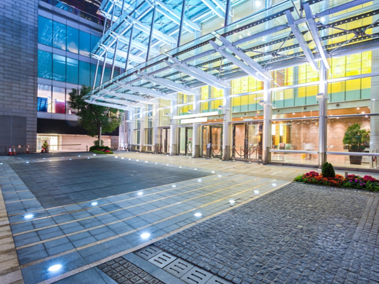 Empty floor near modern building facade