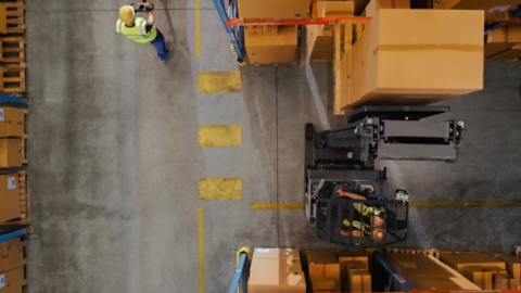 Forklift operator in warehouse