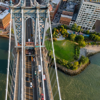 Manhattan bridge with city coastline