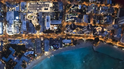 Busy coastal city at dusk 