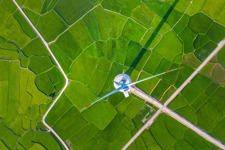 Windmill in green field