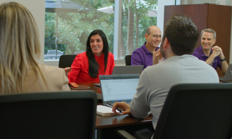 Alessandra Hammond leading her team in a brainstorming session