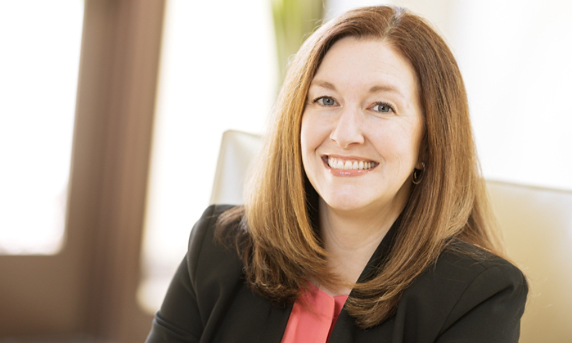 Carrie Ruddy seated at leadership summit