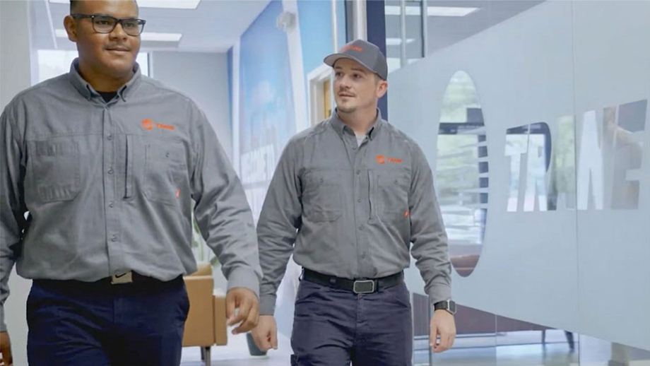 Cody Nelson and technician colleague walking through hallway