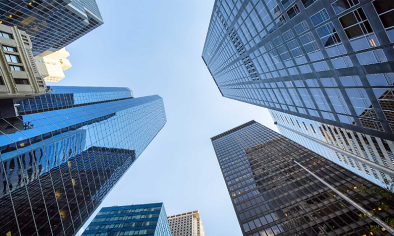 view looking up at financial district buildings