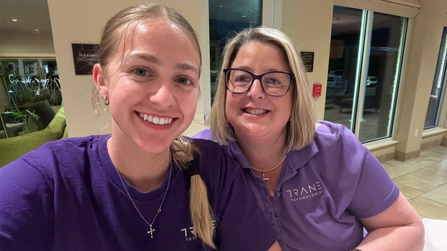 Jennifer and her daughter wearing purple Trane Technologies shirts