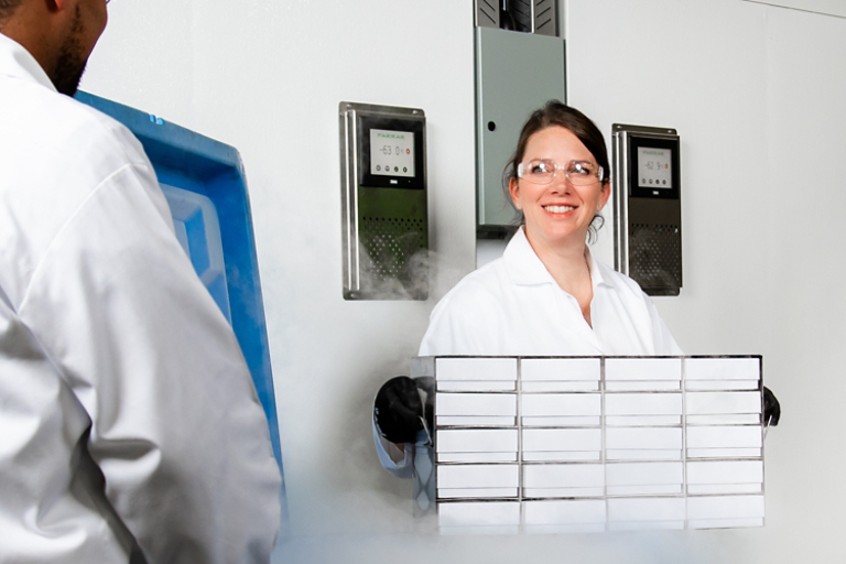 female lab technician holding a container