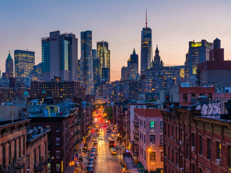 View of Madison Street and Lower Manhattan at sunset from the Manhattan Bridge in New York City
