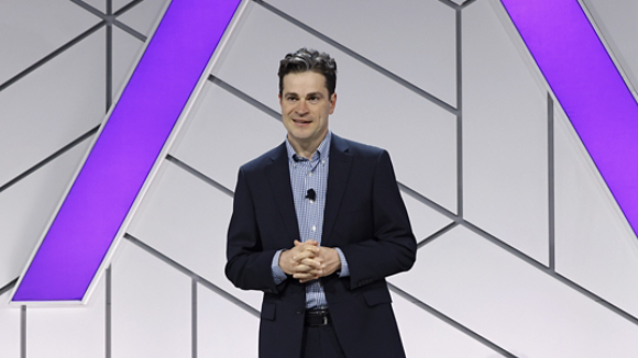 Executive speaking on stage 2