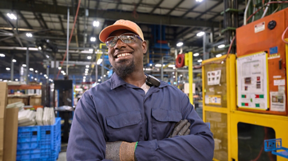 Male employee smiling in manufacturing plant 4