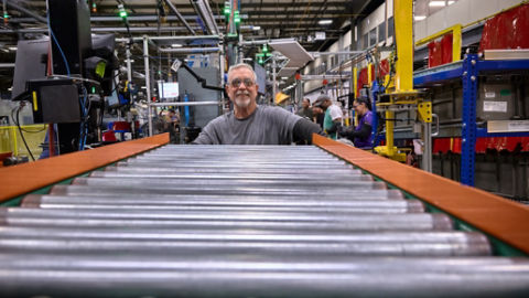 Male employee working on assembly line