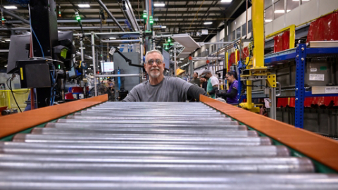 Male employee working on assembly line