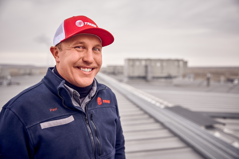 Technician smiling on rooftop 3