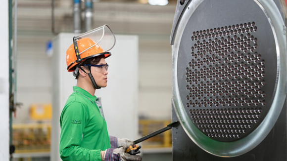 Male plant worker maintaining unit in Taicang