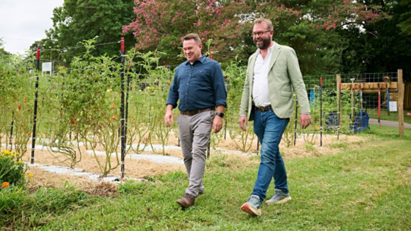 Trane Technologies VP of Sustainability Scott Tew and Carolina Farm Trust President and CEO Zack Wyatt at the Urban Farm at Aldersgate