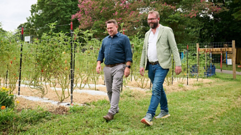 Trane Technologies VP of Sustainability Scott Tew and Carolina Farm Trust President and CEO Zack Wyatt at the Urban Farm at Aldersgate