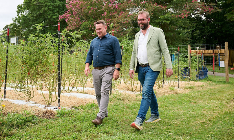 Trane Technologies VP of Sustainability Scott Tew and Carolina Farm Trust President and CEO Zack Wyatt at the Urban Farm at Aldersgate