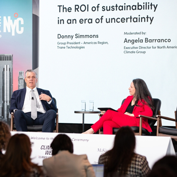 Executive speaking on stage at Climate Week NYC