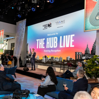Executive speaking on stage at Climate Week NYC