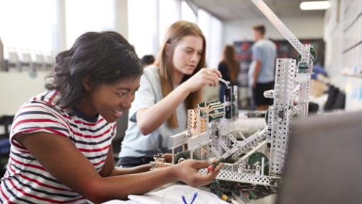 Two Female students working on a project