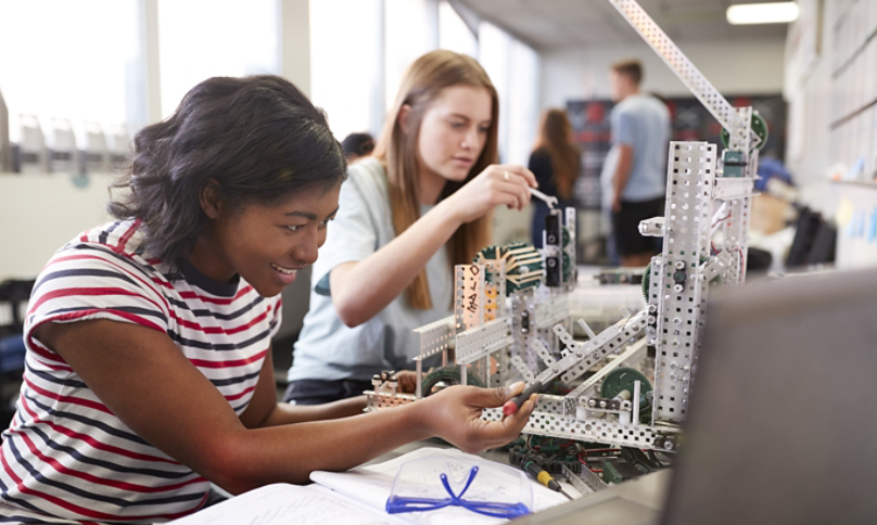 Two Female students working on a project