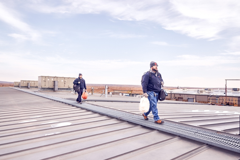 Technicians walking on rooftop 2 