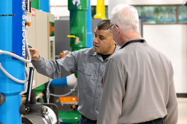 Technicians working with unit