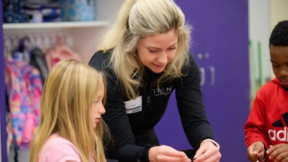 Volunteer working with students 12