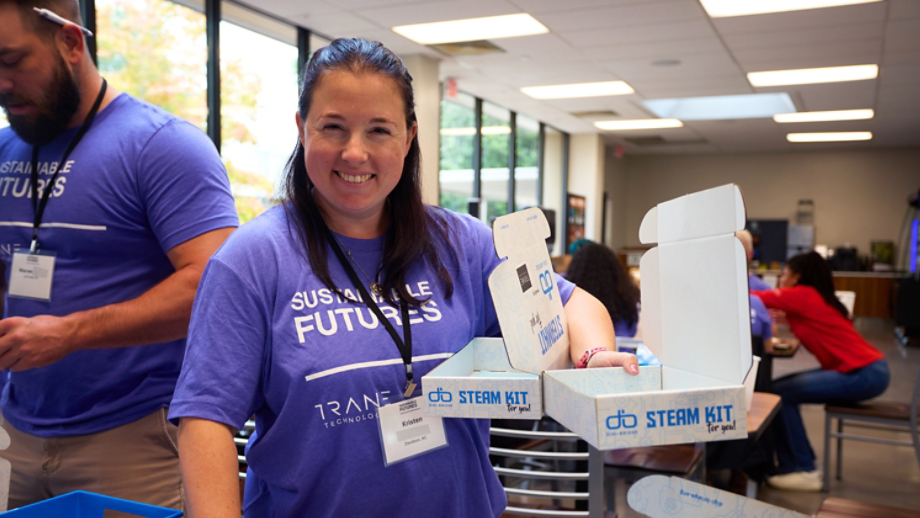 Volunteers packaging educational kit