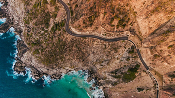 Mountainside with ocean and road