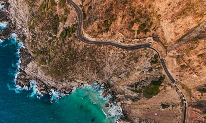 Mountainside with ocean and road